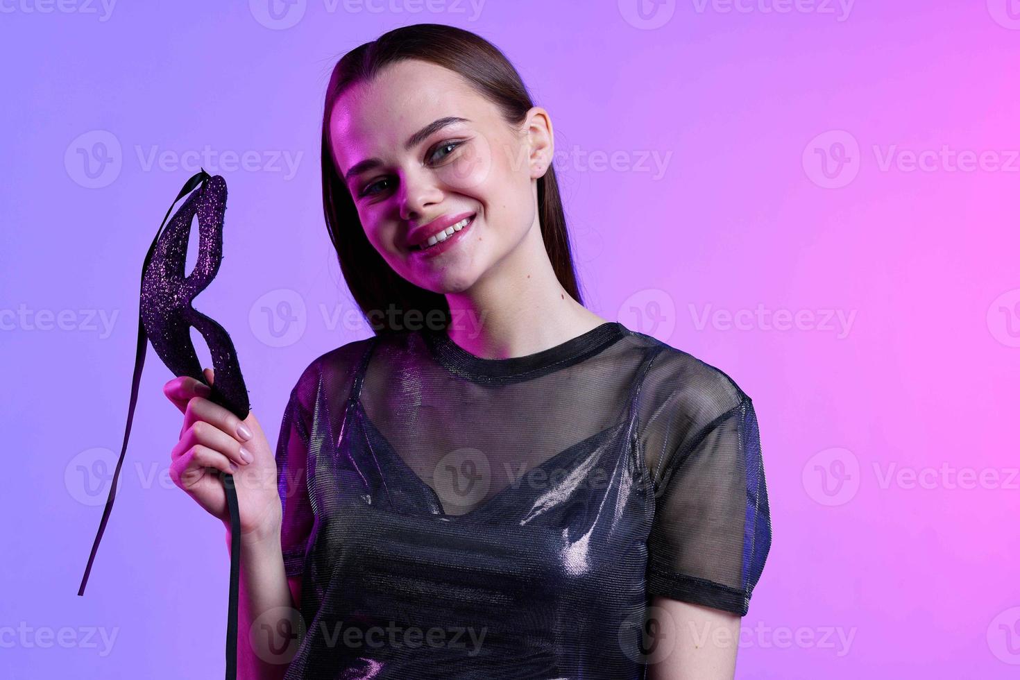 cheerful woman with black mask posing disco luxury photo