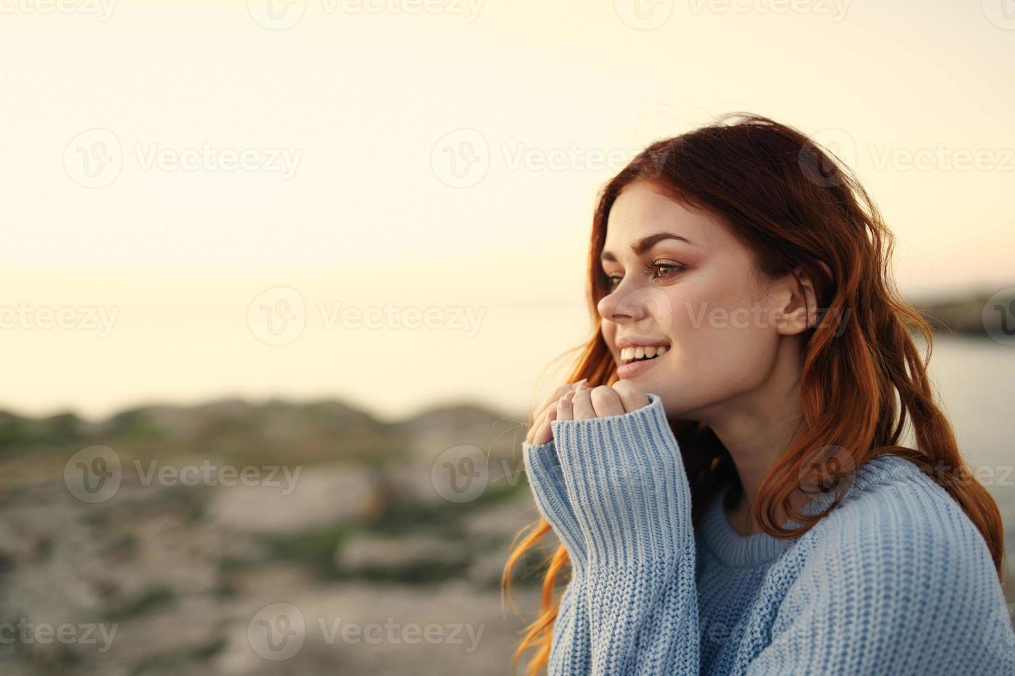 Cheerful woman outdoors landscape mountains freedom photo