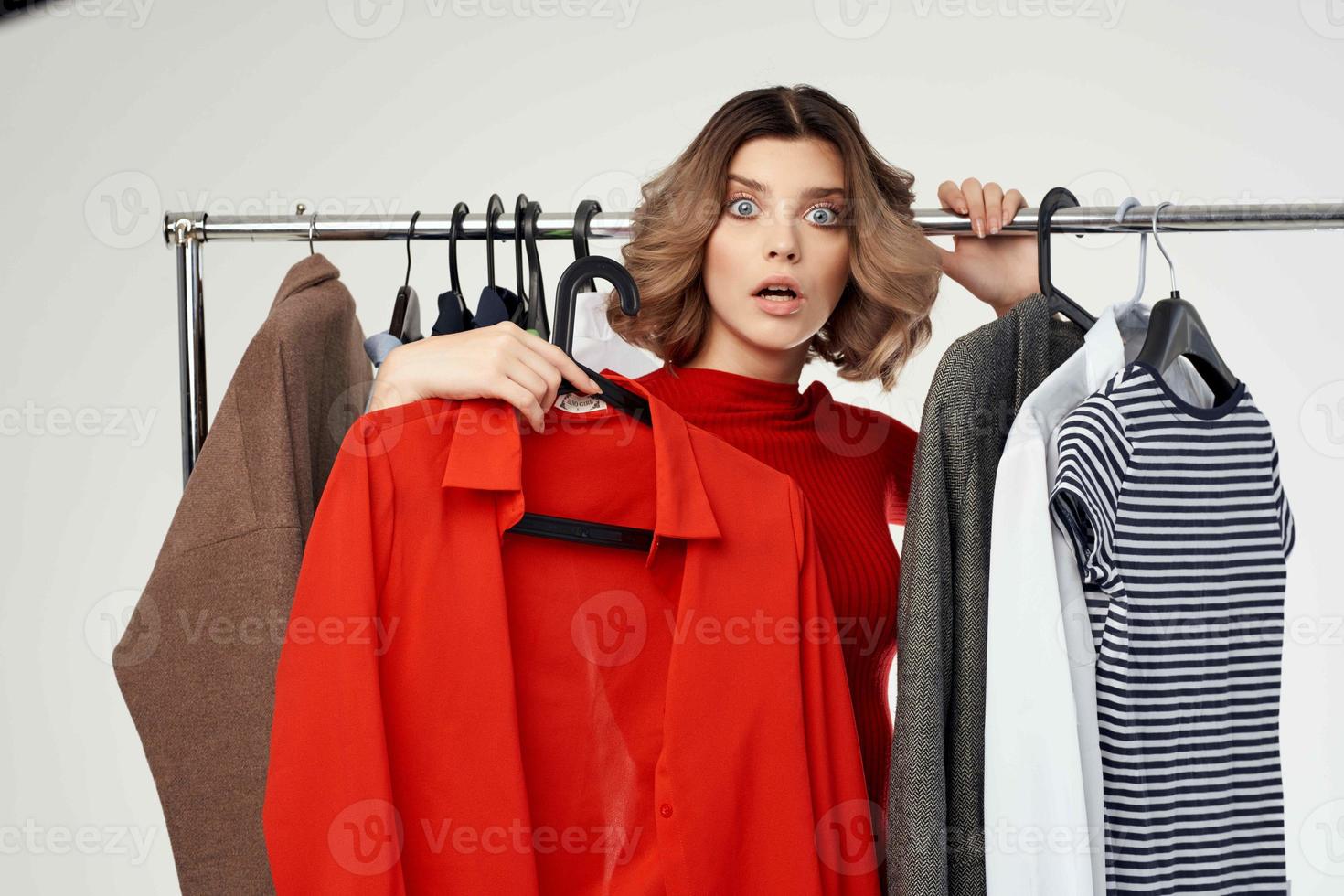 beautiful woman trying on clothes shop shopaholic isolated background photo