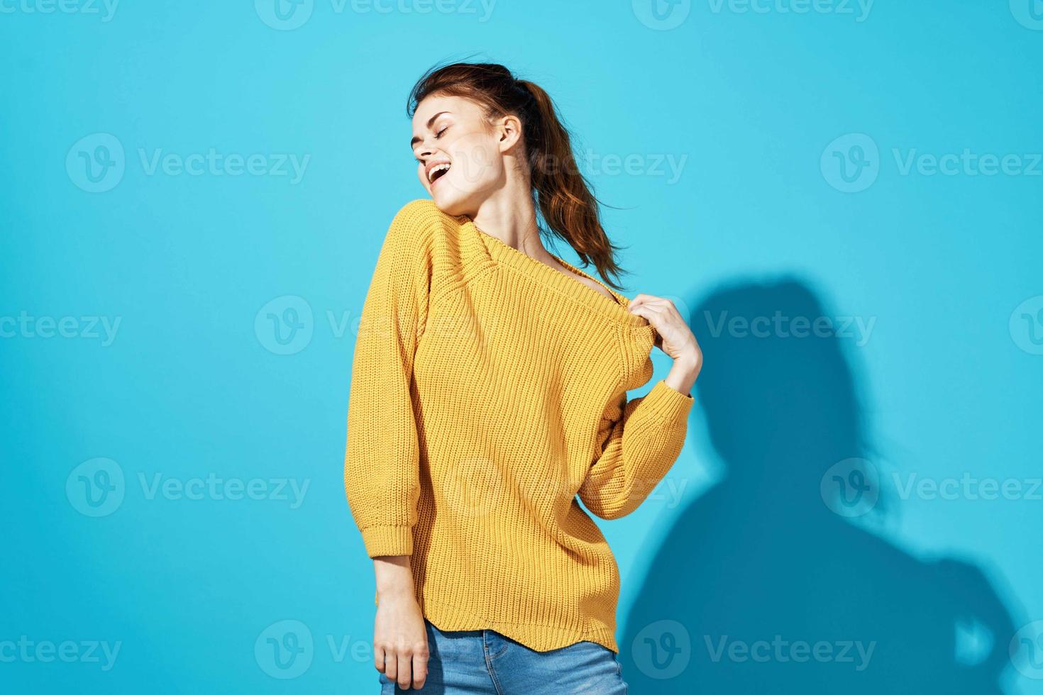 attractive woman in yellow sweater fashionable hairstyle emotions posing photo