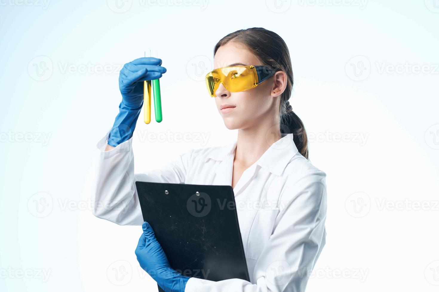 female laboratory assistant chemical solution biotechnology microbiology photo