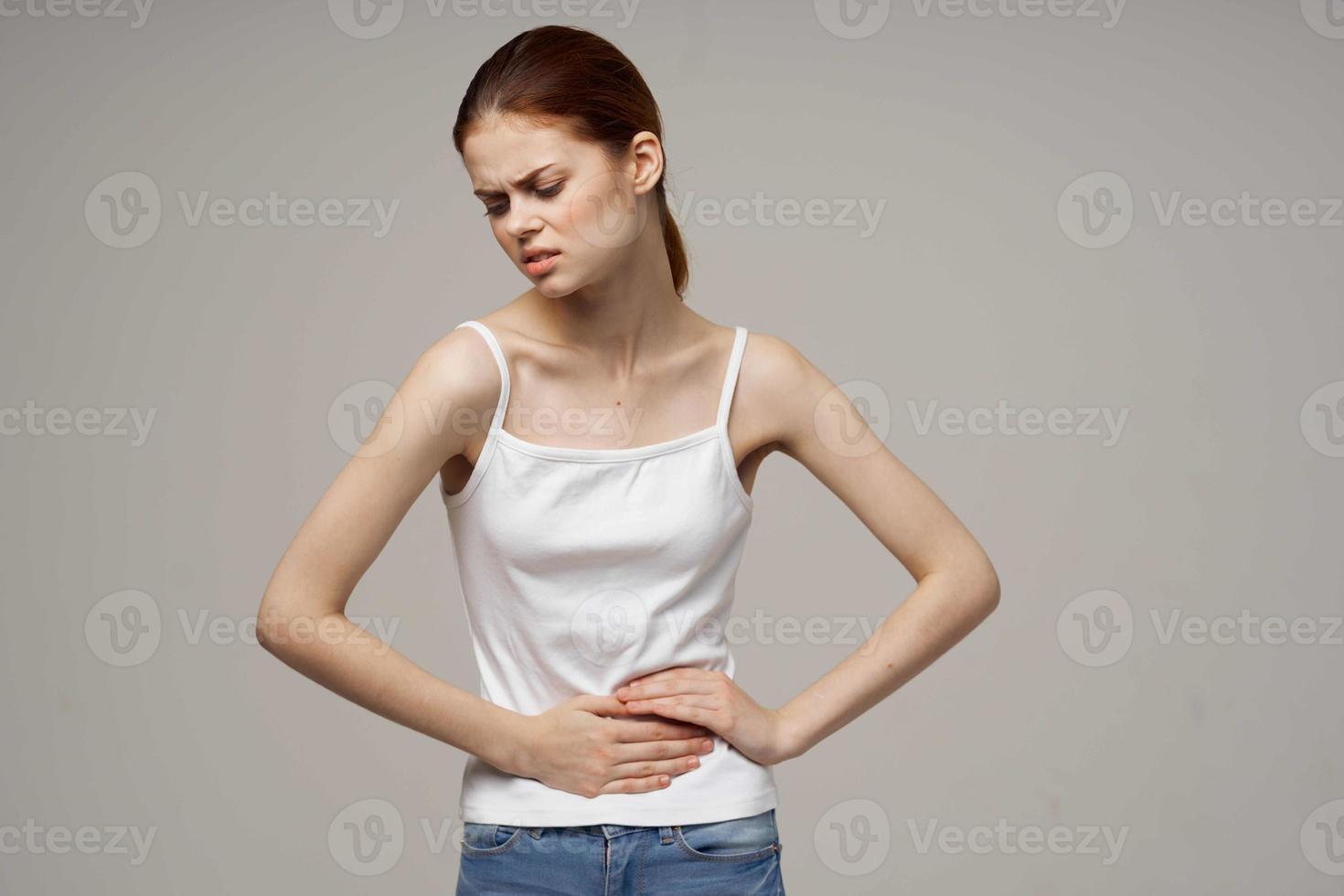 sick woman groin pain intimate illness gynecology discomfort studio treatment photo