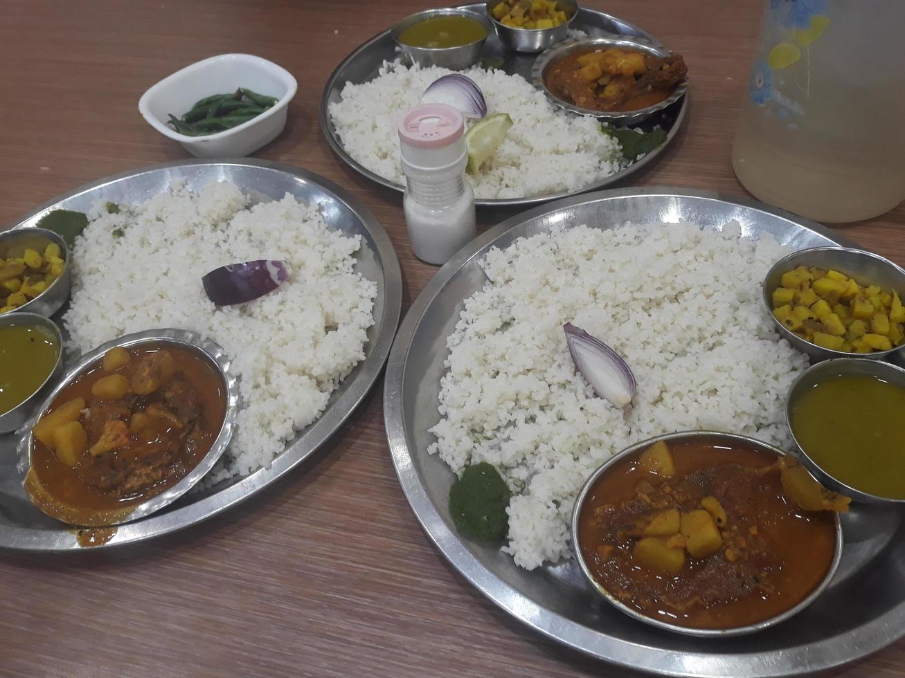 Traditional food of Bangladesh is rice and curry photo