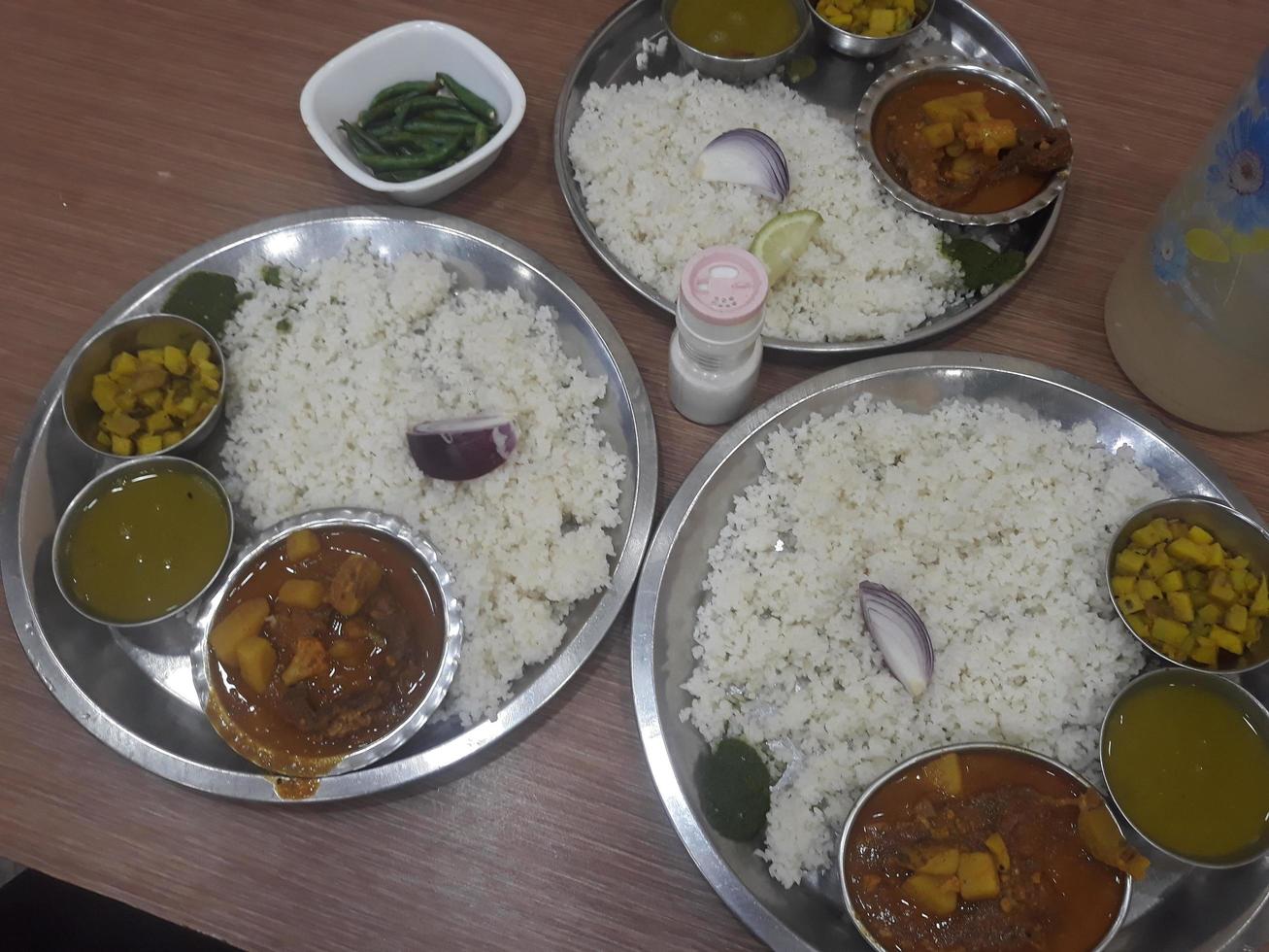 Traditional food of Bangladesh is rice and curry photo