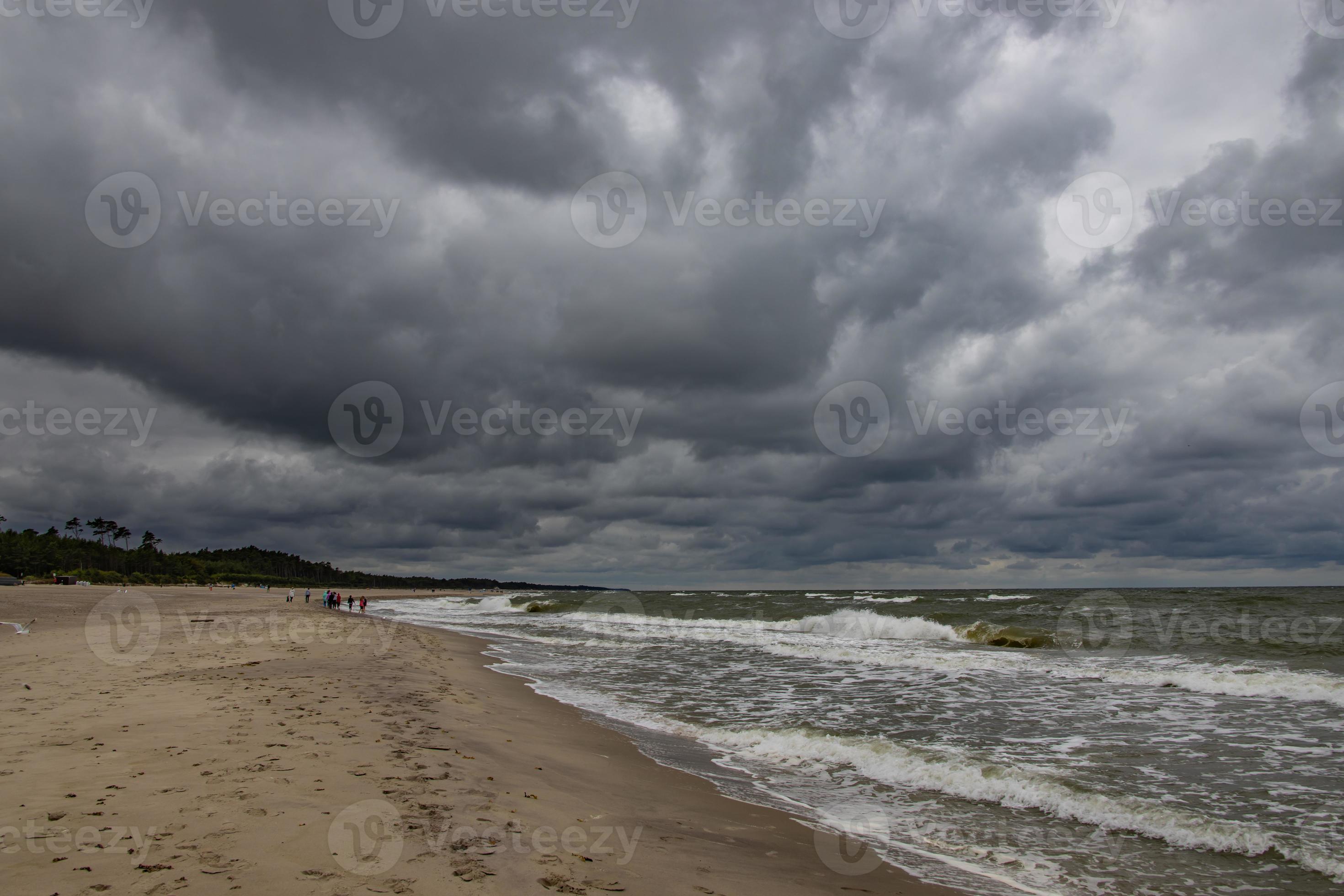 wide beach on the Baltic Sea in Poland on a summer cloudy gray