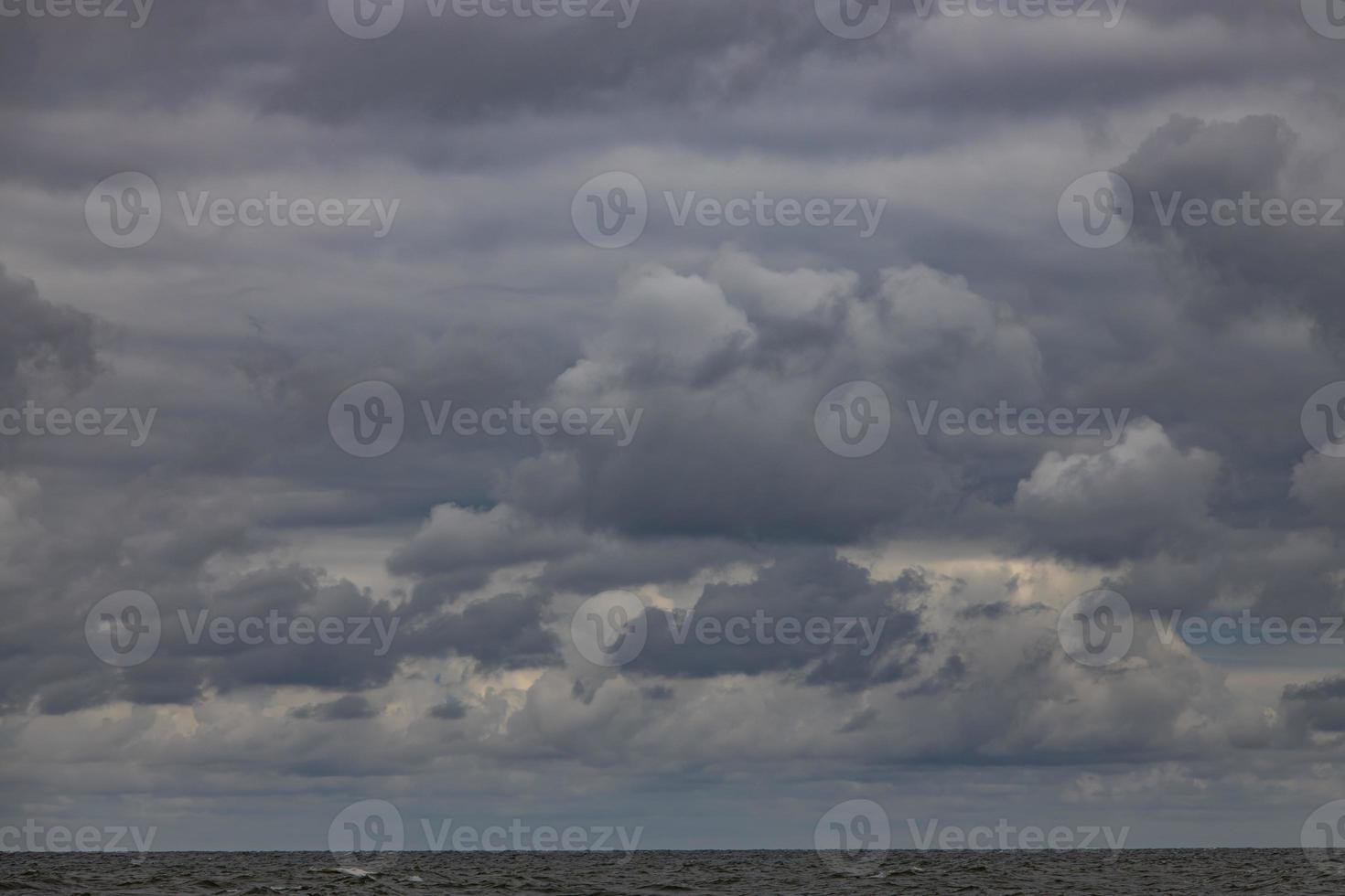 wide beach on the Baltic Sea in Poland on a summer cloudy gray cold day photo