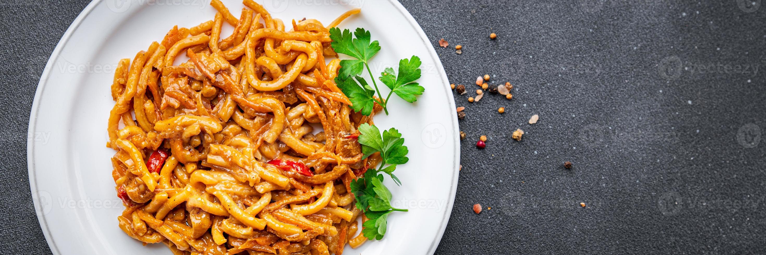 noodles with vegetables tomato sauce ready to eat healthy meal food snack on the table copy space food background rustic top view veggie vegan or vegetarian photo