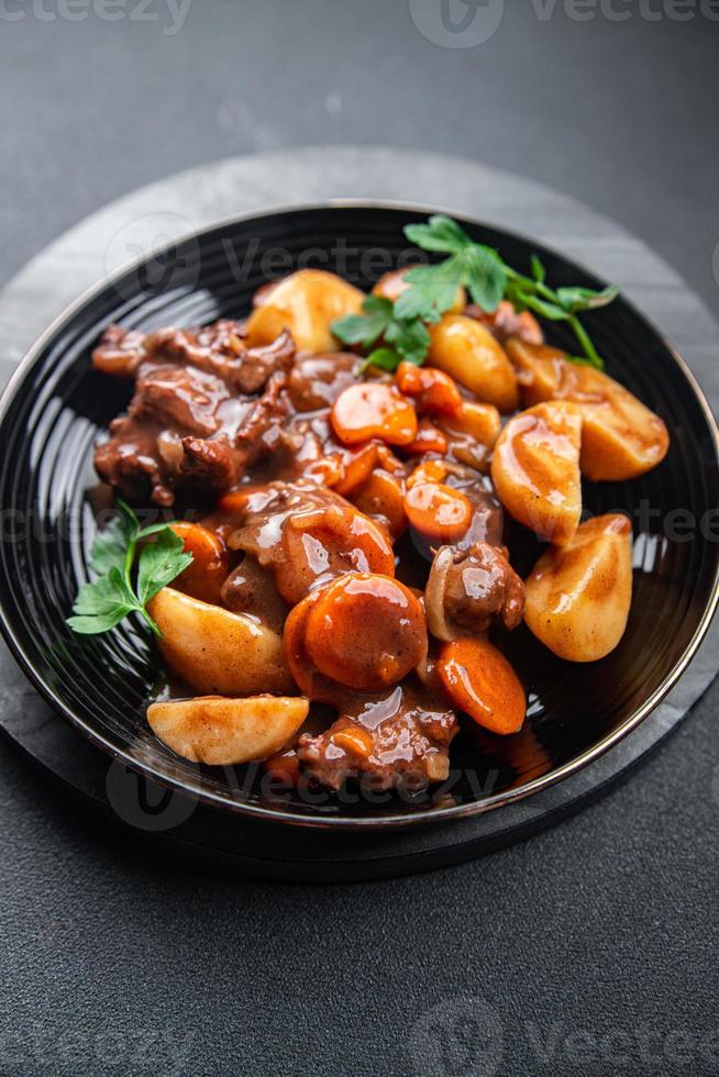 beef bourguignon meat dish with vegetables ready to eat healthy meal food snack on the table copy space food background rustic photo