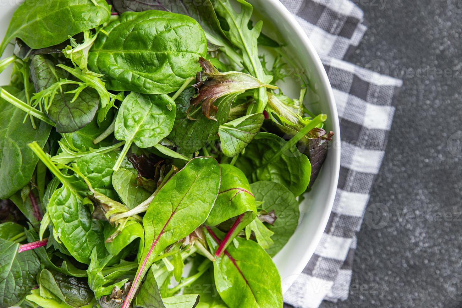 green salad leaves mix mix micro green, healthy snack food on the table copy space food background rustic top view photo
