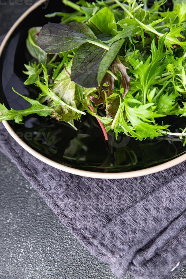 green salad leaves mix mix micro green, healthy snack food on the table copy space food background rustic top view photo