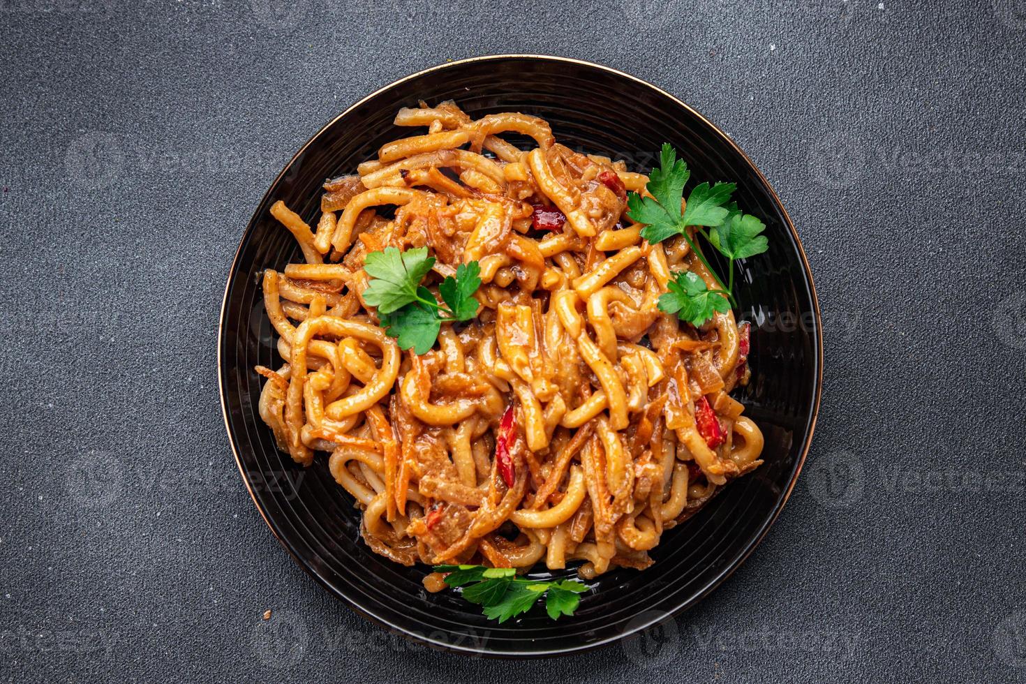 noodles with vegetables tomato sauce ready to eat healthy meal food snack on the table copy space food background rustic top view veggie vegan or vegetarian photo