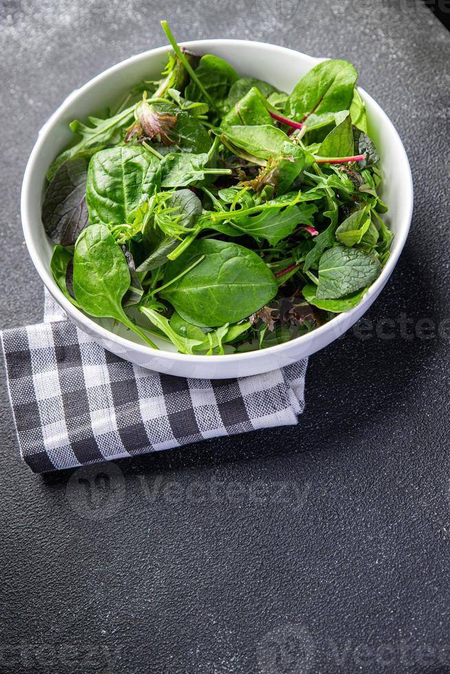 green salad leaves mix mix micro green, healthy snack food on the table copy space food background rustic top view photo