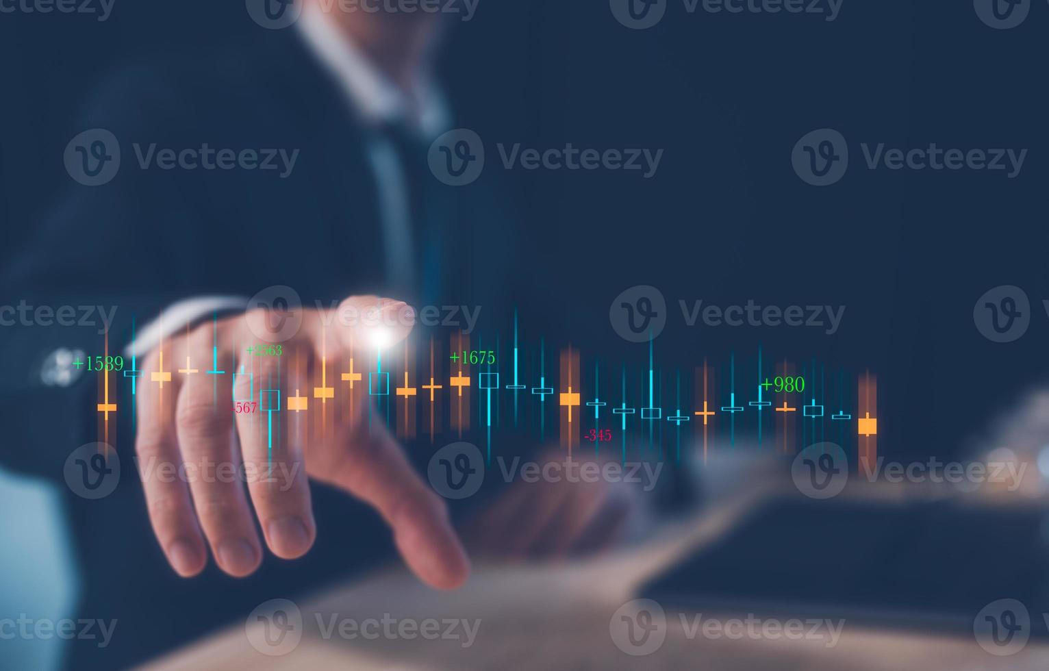investment financial and saving concept, businessman working on table with computer laptop and  virtual trading graph, business growth and investment strategy. stock market photo