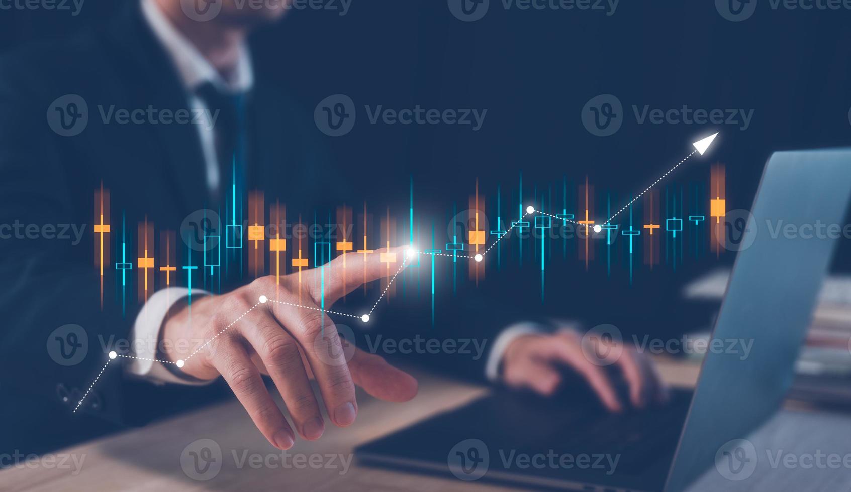 investment financial and saving concept, businessman working on table with computer laptop and  virtual trading graph, business growth and investment strategy. stock market trading, economy exchange photo
