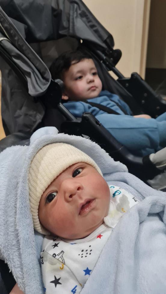 New Born Asian Pakistan Baby Boy is Relaxing. He is Named Azlan Ahmed Shah, Born on 14-March-2023 at Luton and Dunstable Hospital at Luton England UK. Image Captured on 20-March-2023 photo