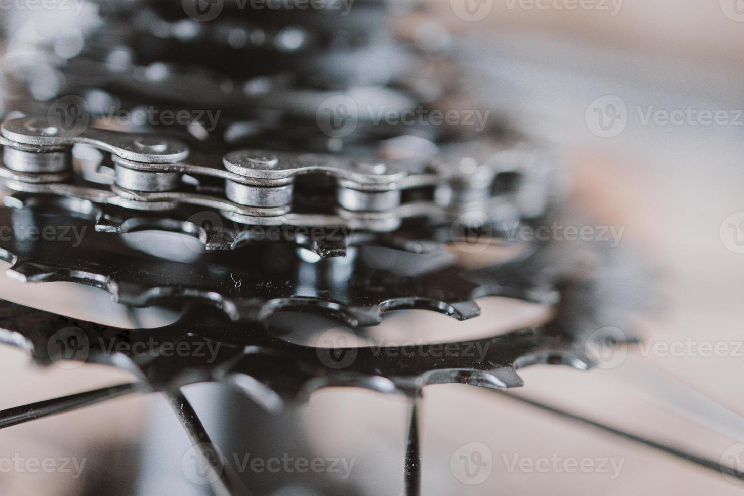 black gear wheel with bicycle chain photo