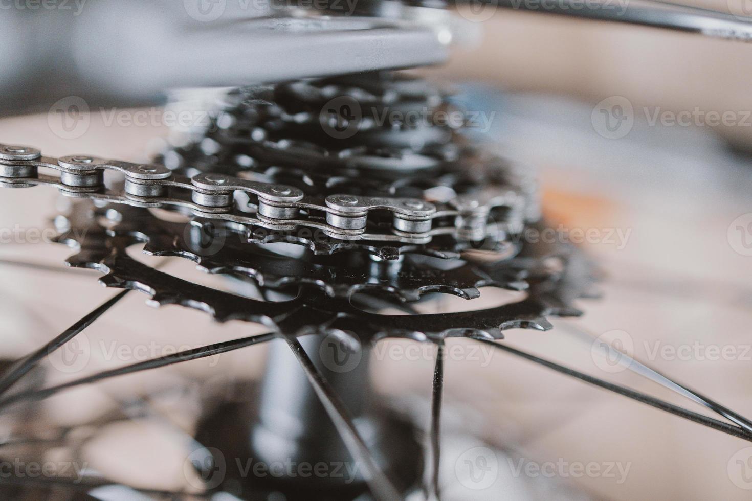 black gear wheel with bicycle chain photo