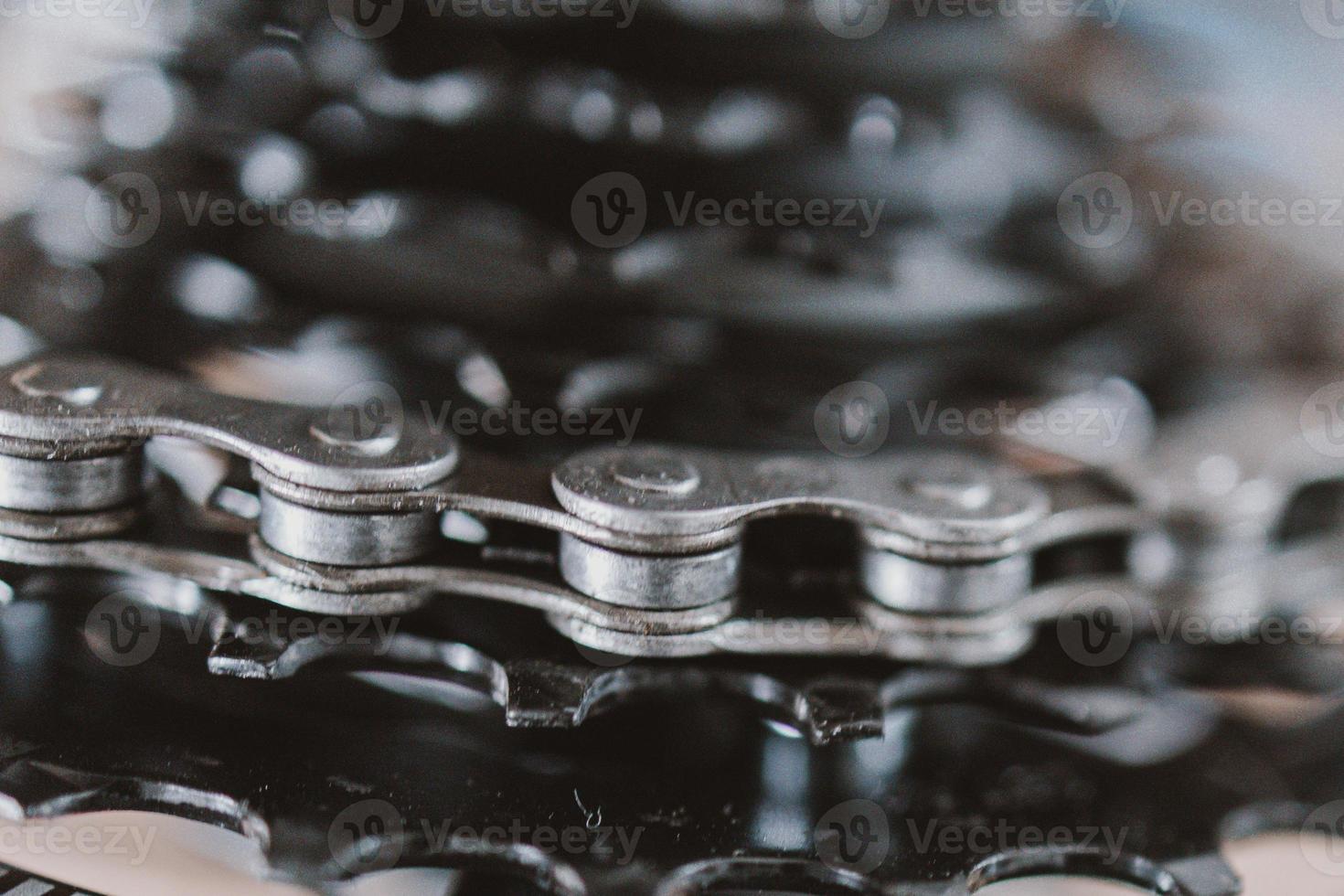 black gear wheel with bicycle chain photo