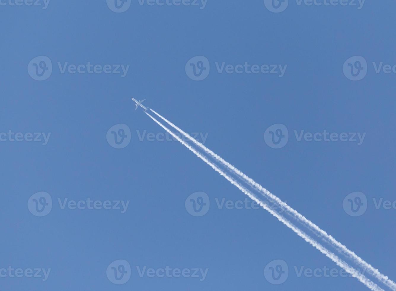 trace from plane in a blue sky photo