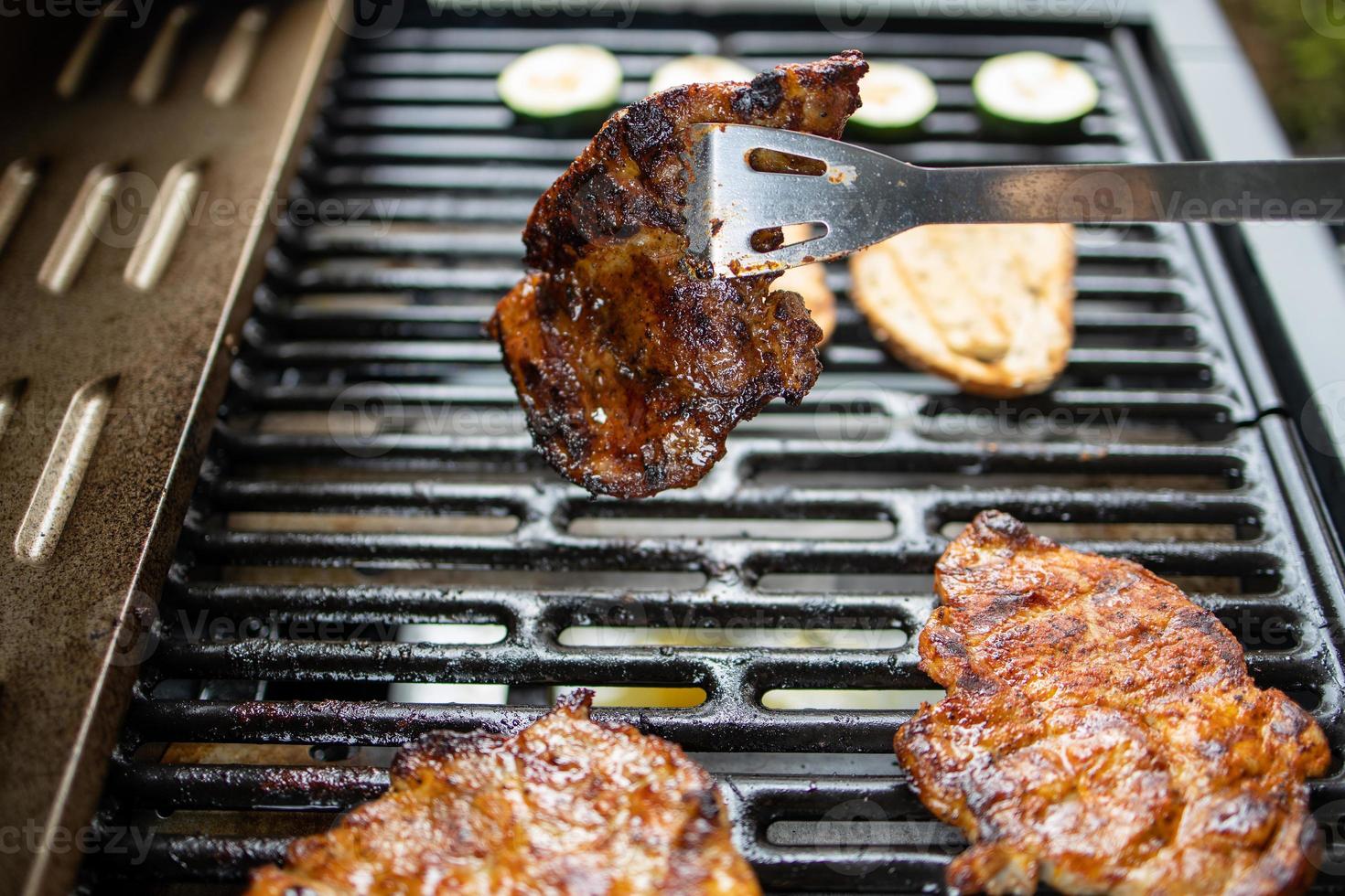 pork neck grilled on a gas grill. Closeup photo