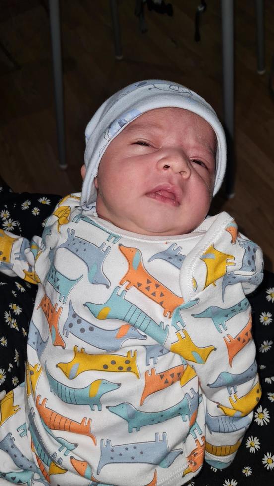 New Born Asian Pakistan Baby Boy is Relaxing. He is Named Azlan Ahmed Shah, Born on 14-March-2023 at Luton and Dunstable Hospital at Luton England UK. Image Captured on 20-March-2023 photo