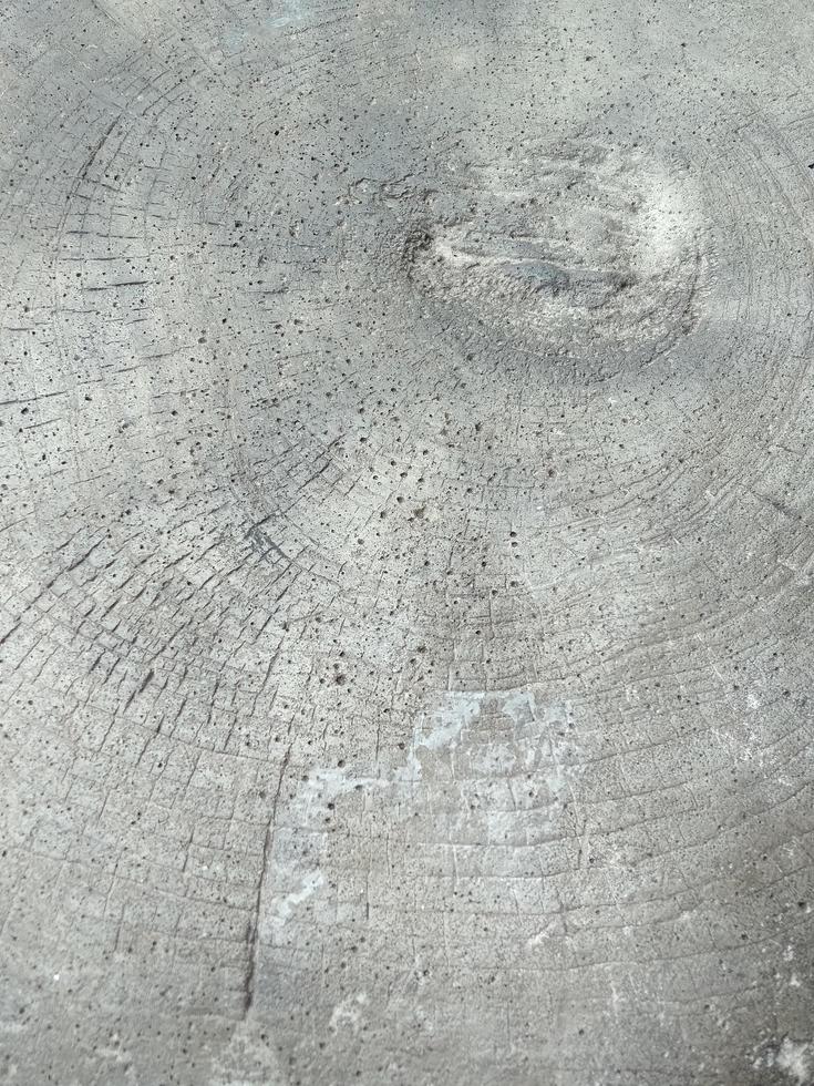 Wood grain concrete has a rough surface with many holes. photo