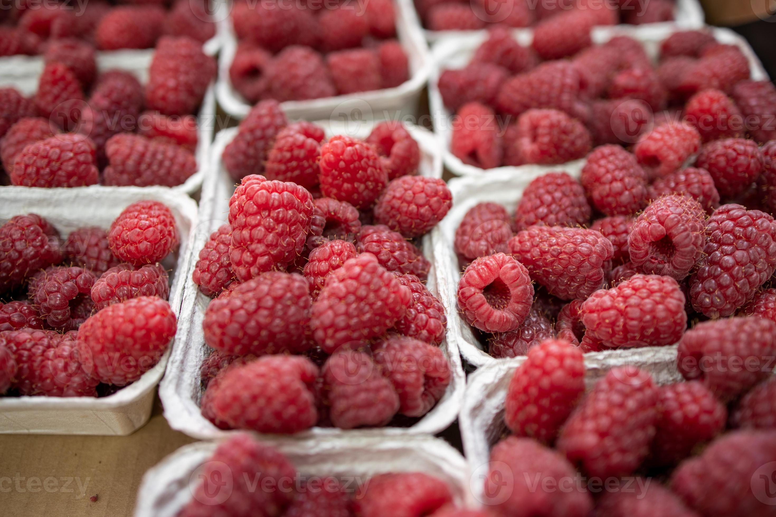 raspberries in containers on a stall forming a background 22326293
