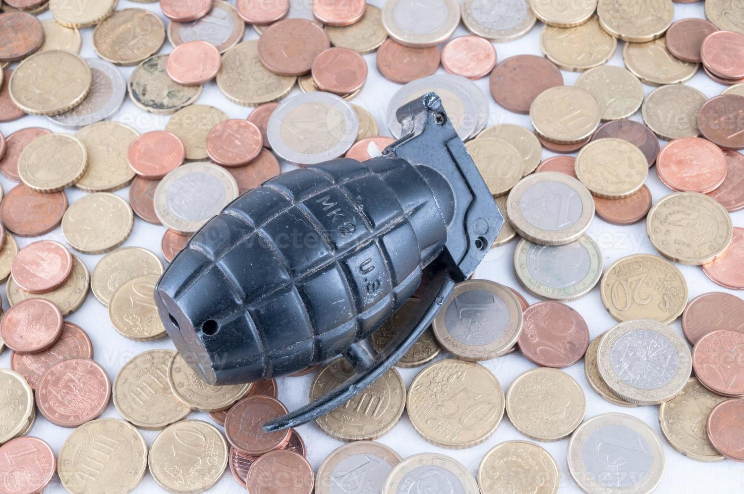 Grenade and coins photo