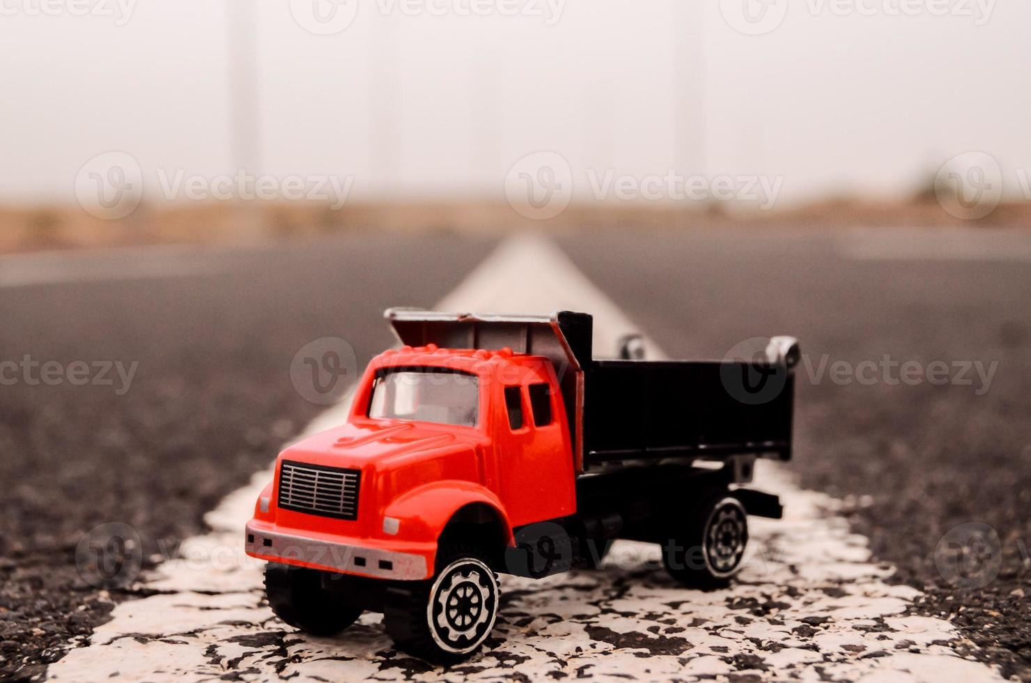 Toy truck on the road photo