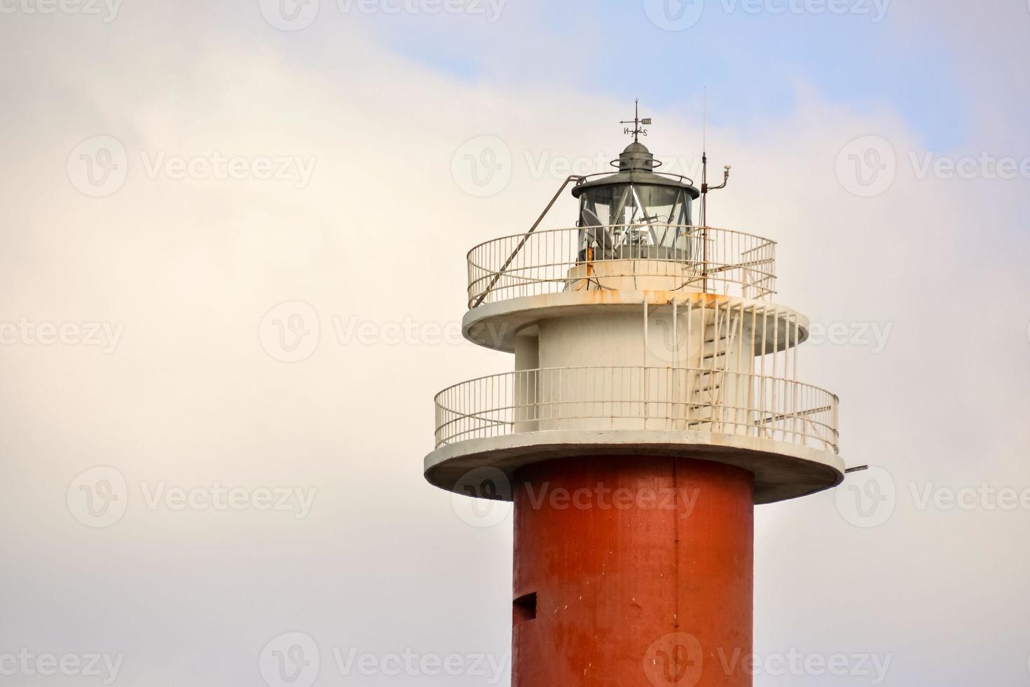 Lighthouse by the sea photo