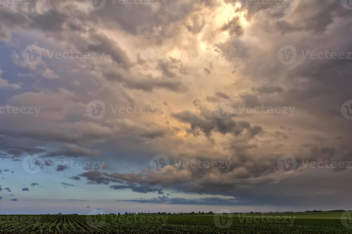 Amazing stormy clouds over the field. photo