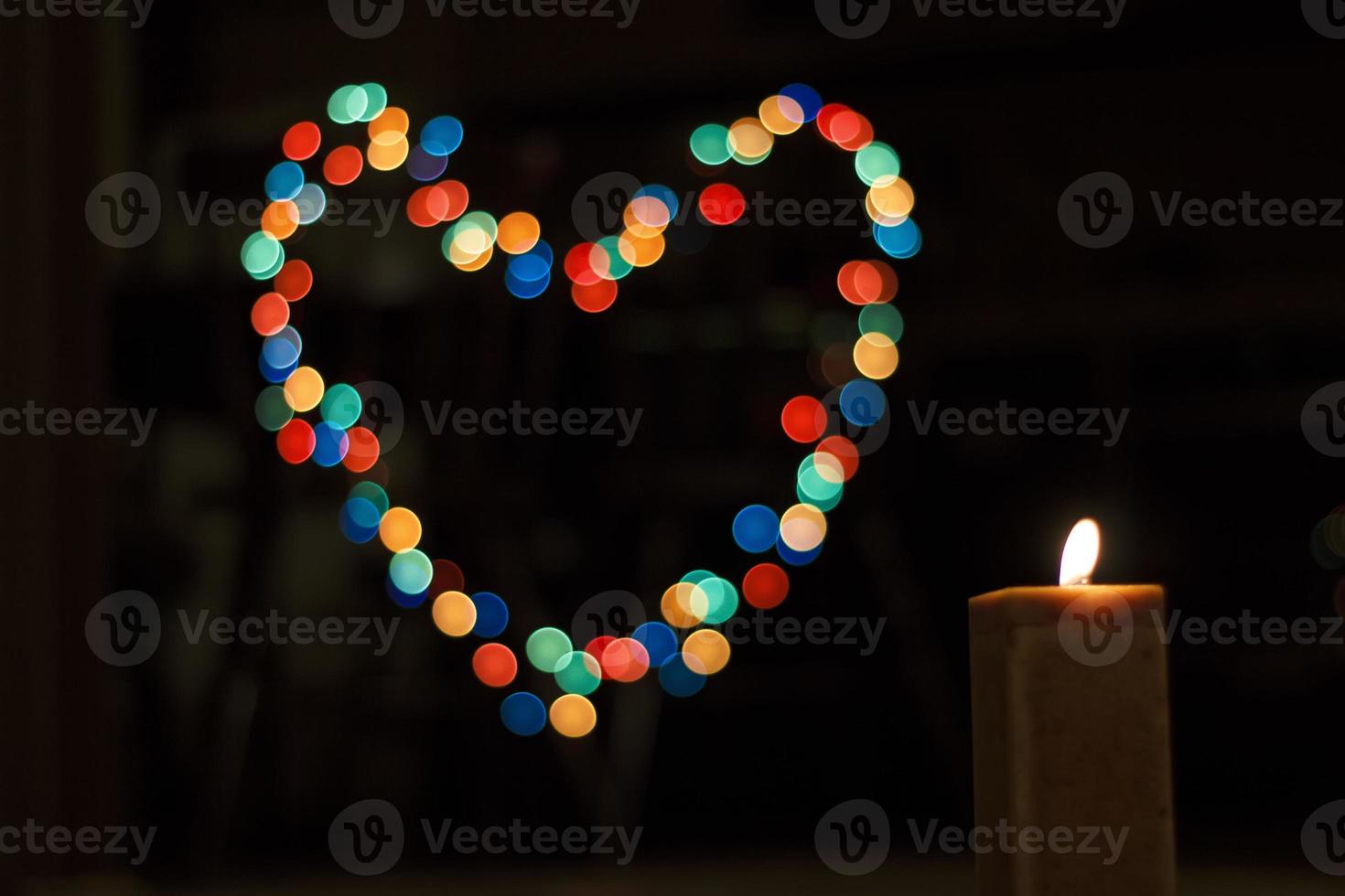 Candles light with background bokeh like a heart. Abstract candle background. Horizontal view. photo