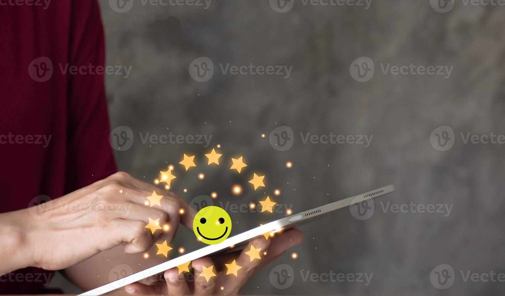 close up Woman hand using smart phone and give five star symbol to increase rating of product and service concept, Customer service experience and business satisfaction survey. photo