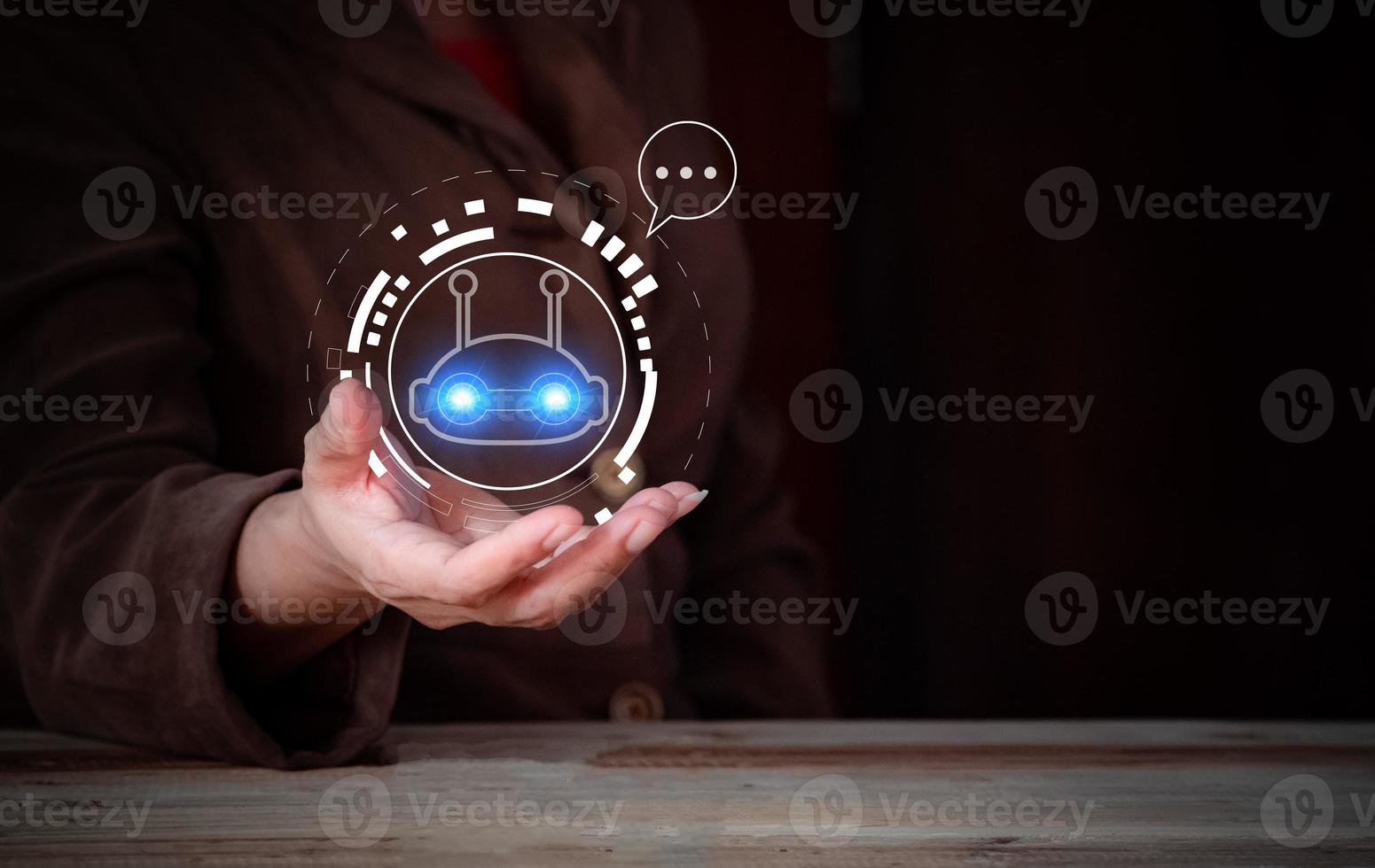 Businesswoman holding a virtual hologram .Hand touching digital chatbot for provide access to information and data in online network, robot application and global connection, conversation AI. photo