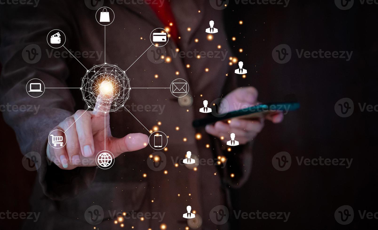 Businessman hand holding smartphone with social network icons on dark background. holding virtual Global Internet connection metaverse. Business global internet connection application technology. photo