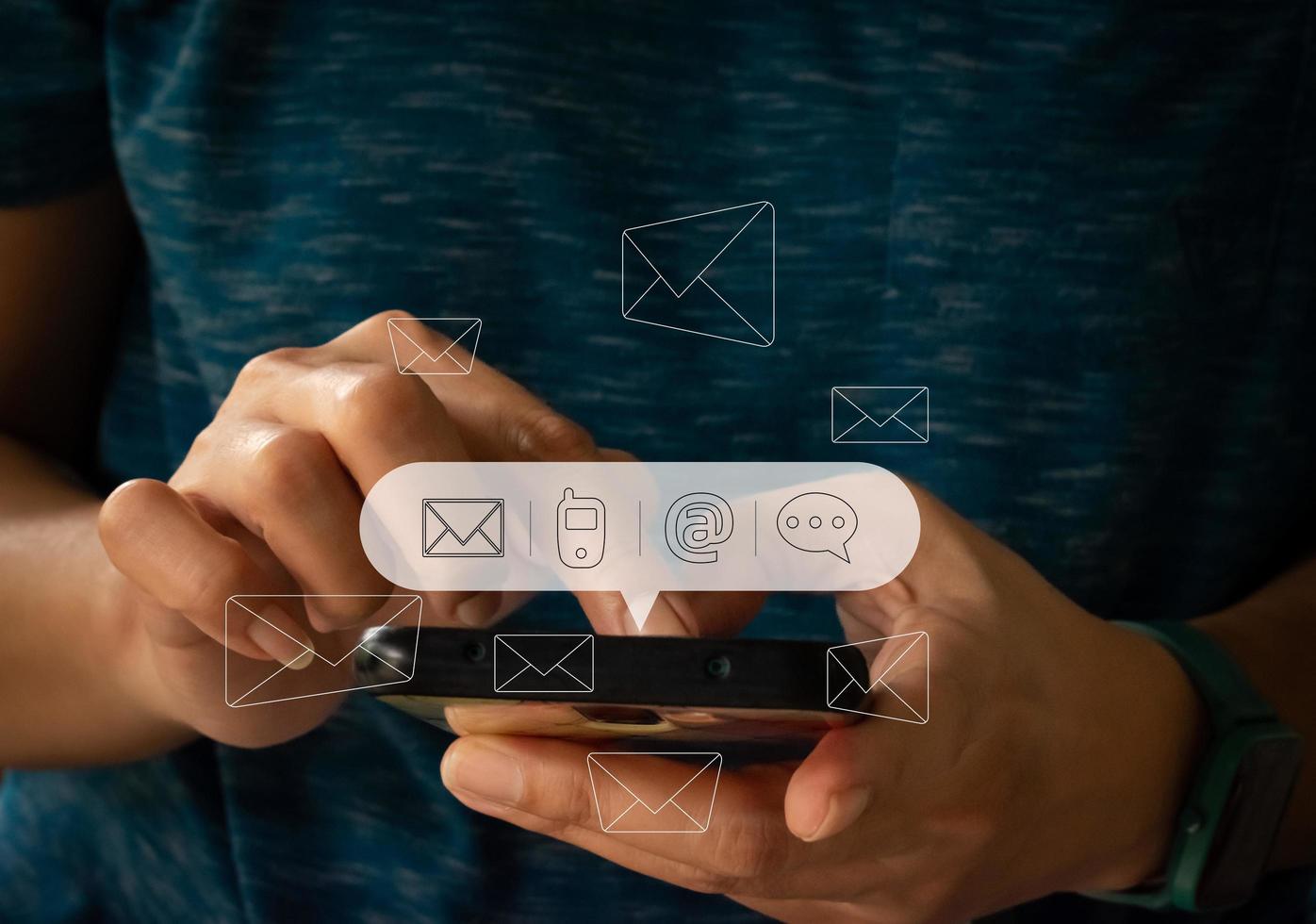 Contact us or Customer support hotline people connect. Businessman using a mobile and touching on virtual screen contact icons. photo