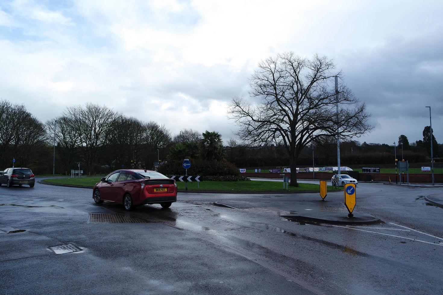 Low Angle View of British Road and Traffic at Luton Town of England UK. The Image Was Captured at Central Luton  City During a Cold and Cloudy Evening of 24-March-2023 photo