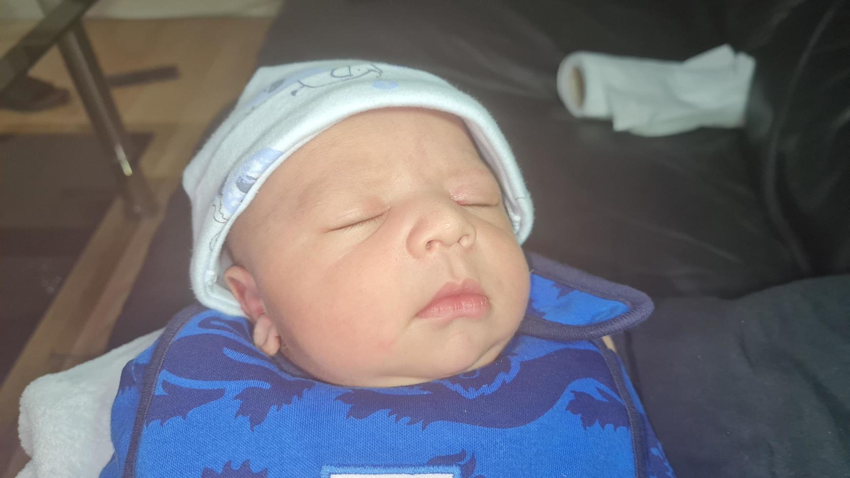 New Born Asian Pakistan Baby Boy is Relaxing. He is Named Azlan Ahmed Shah, Born on 14-March-2023 at Luton and Dunstable Hospital at Luton England UK. Image Captured on 20-March-2023 photo