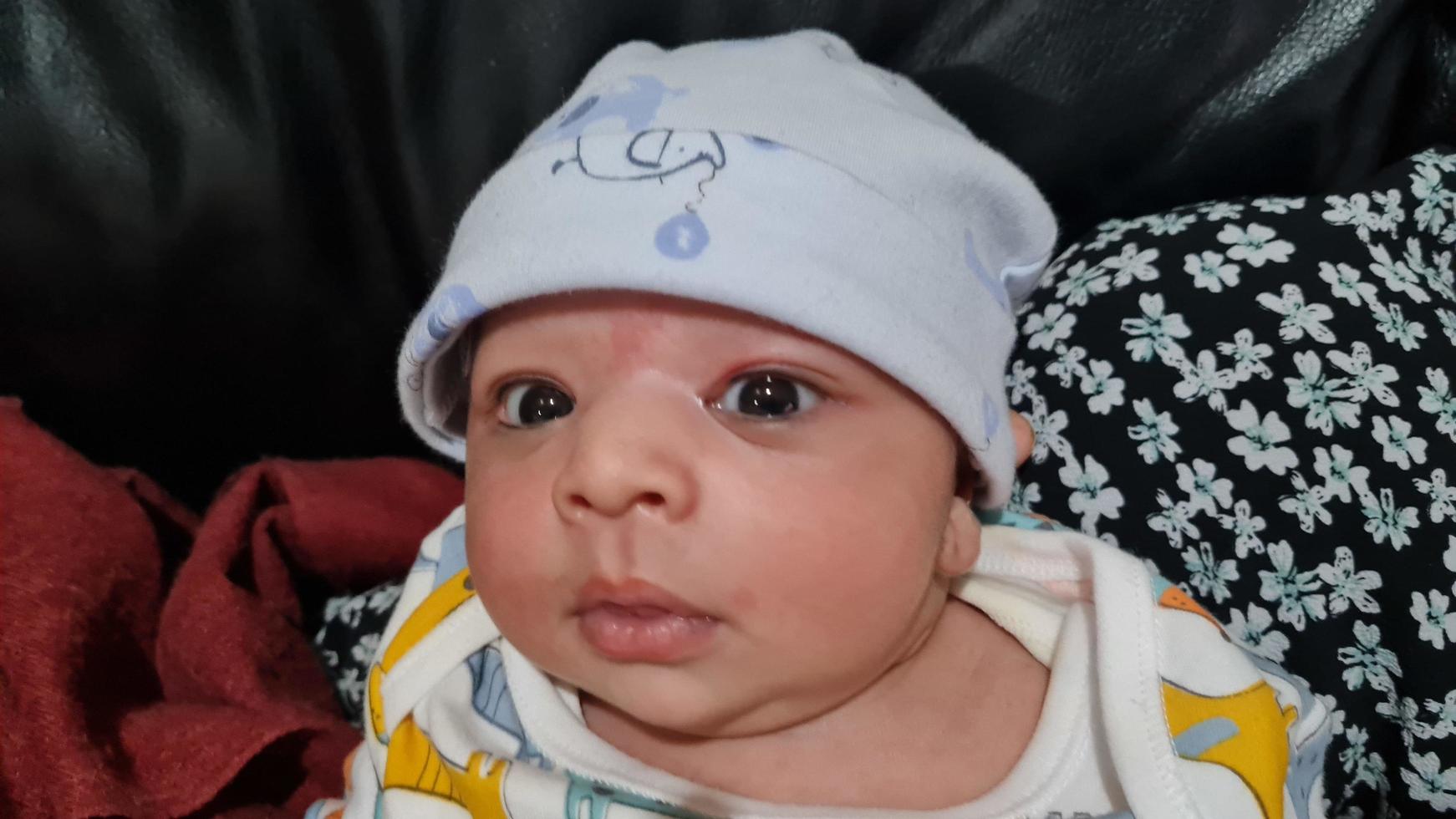 New Born Asian Pakistan Baby Boy is Relaxing. He is Named Azlan Ahmed Shah, Born on 14-March-2023 at Luton and Dunstable Hospital at Luton England UK. Image Captured on 20-March-2023 photo