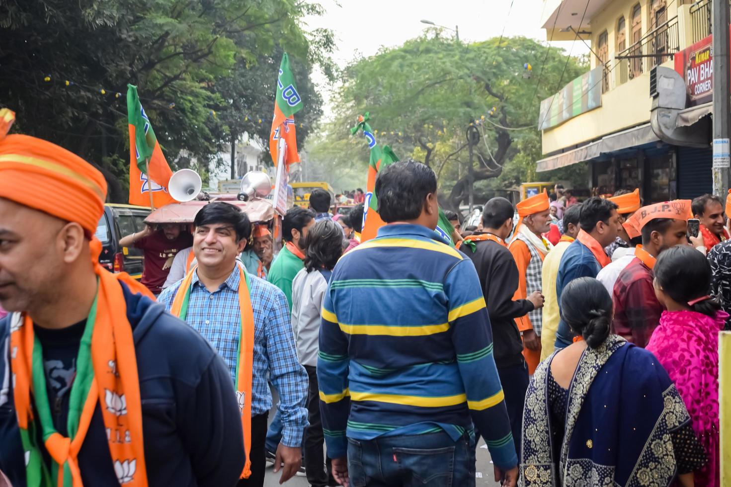 Delhi, India, March 02 2023 -Bharatiya Janata Party - BJP supporter during mega road show in support of BJP candidate Pankaj Luthara to file nomination papers ahead of MCD local body Elections 2022 photo