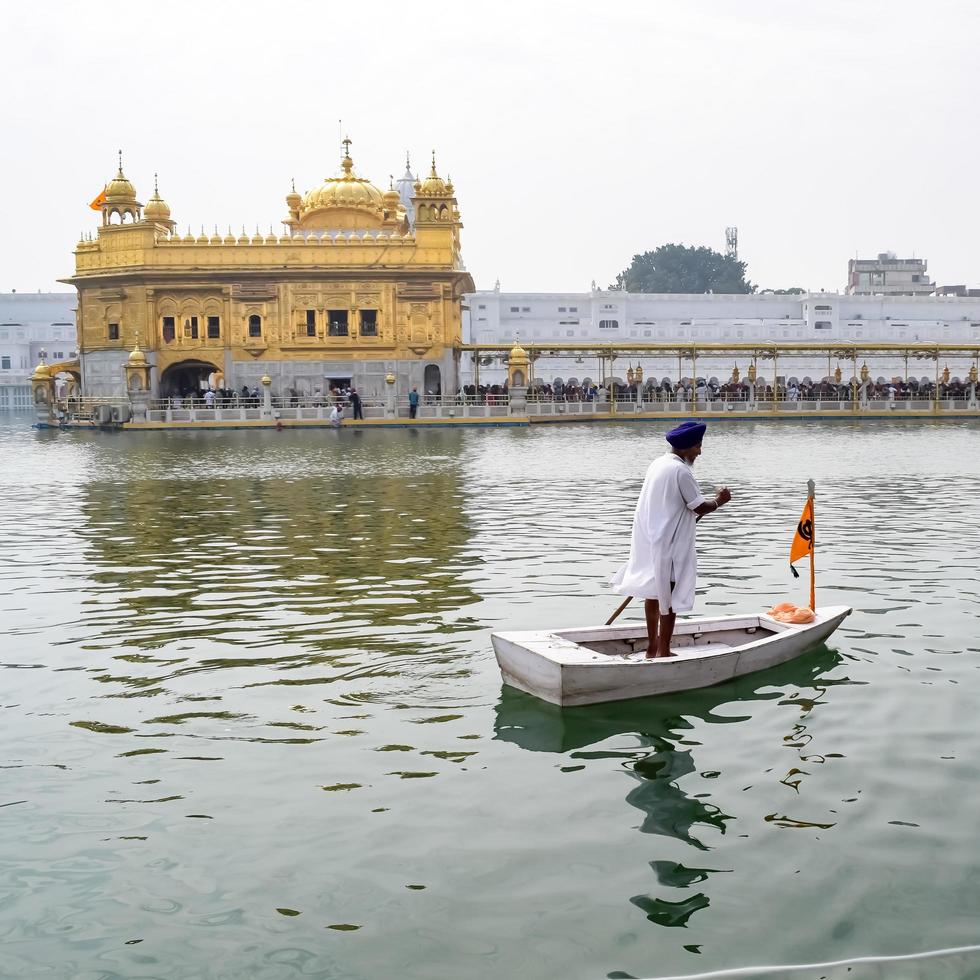 Amritsar, India - February 26 2023  - Unidentified devotees from various parts at Golden Temple - Harmandir Sahib in Amritsar, Punjab, India, Famous indian sikh landmark, Golden Temple photo