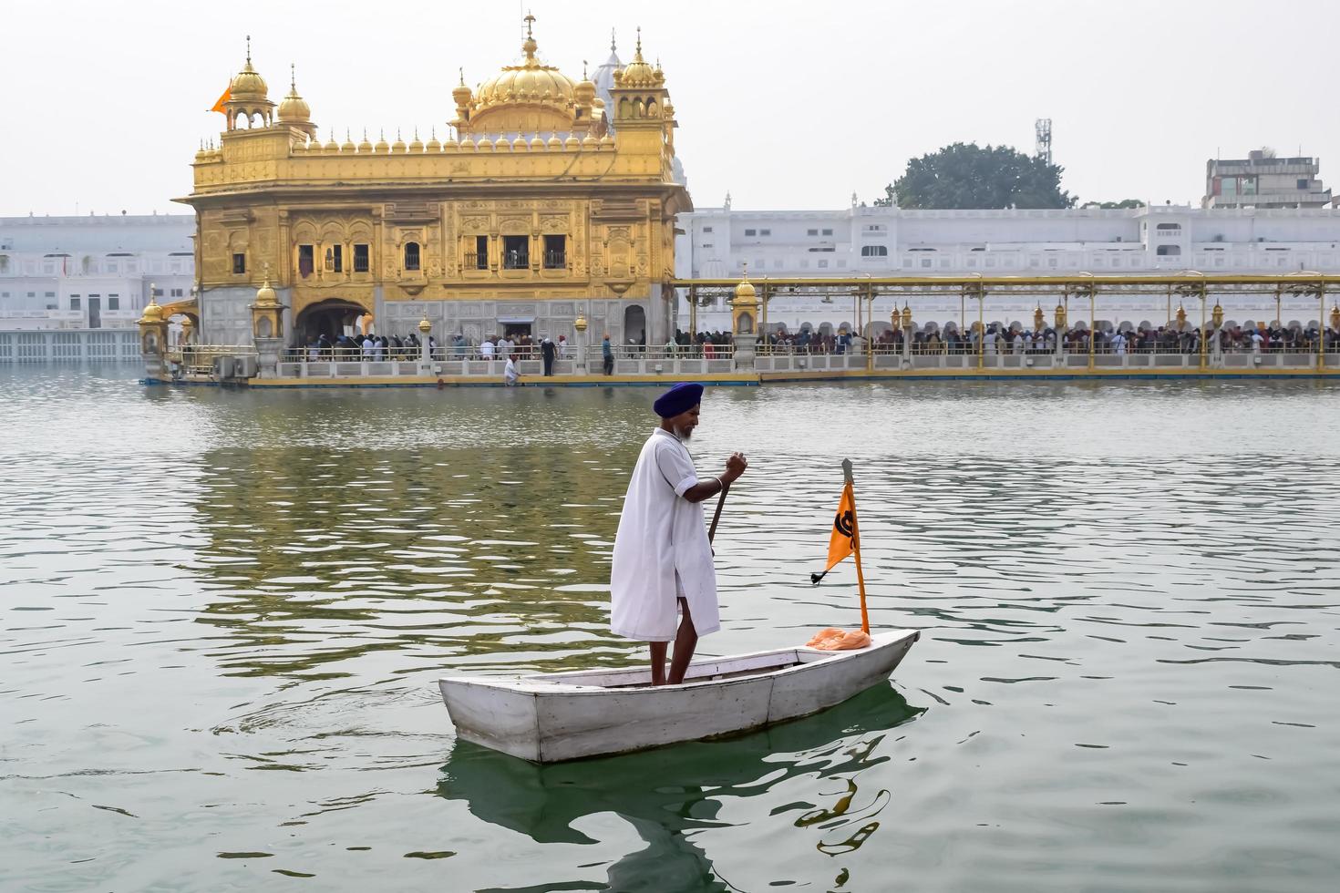 Amritsar, India - February 26 2023  - Unidentified devotees from various parts at Golden Temple - Harmandir Sahib in Amritsar, Punjab, India, Famous indian sikh landmark, Golden Temple photo