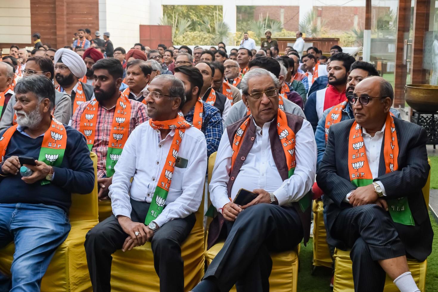 Delhi, India, March 02 2023 -Bharatiya Janata Party - BJP supporter during mega road show in support of BJP candidate Pankaj Luthara to file nomination papers ahead of MCD local body Elections 2022 photo