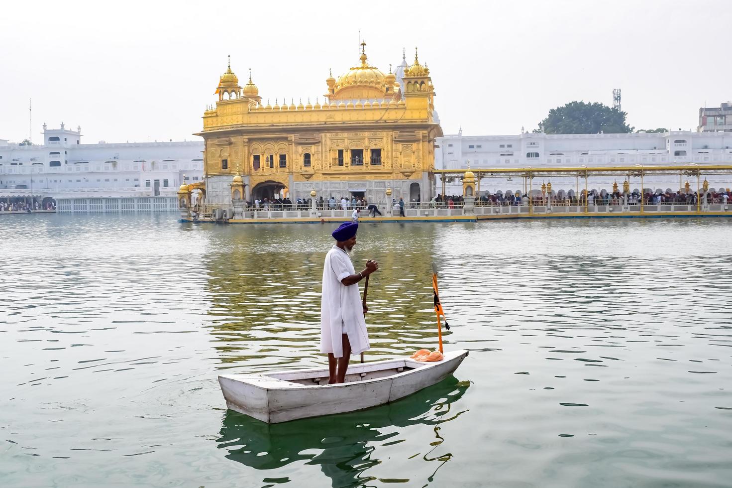 Amritsar, India - February 26 2023  - Unidentified devotees from various parts at Golden Temple - Harmandir Sahib in Amritsar, Punjab, India, Famous indian sikh landmark, Golden Temple photo