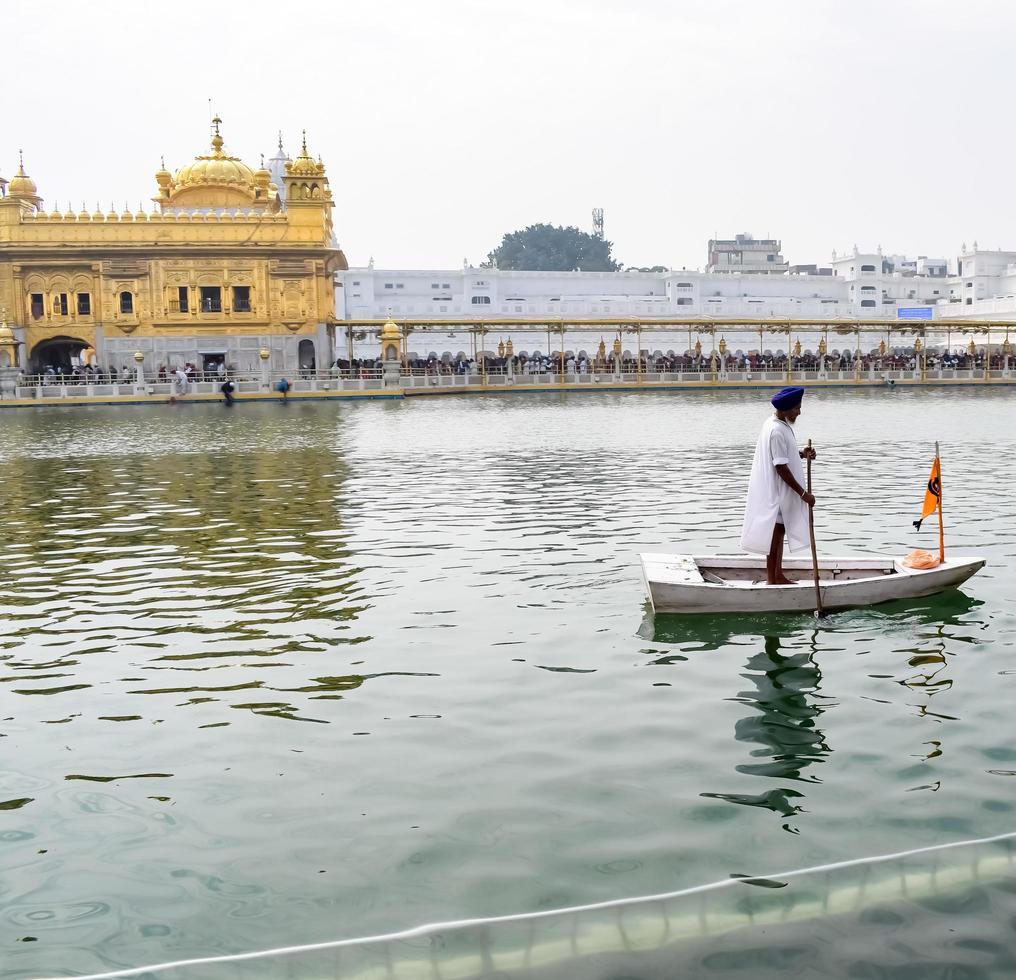 Amritsar, India - February 26 2023  - Unidentified devotees from various parts at Golden Temple - Harmandir Sahib in Amritsar, Punjab, India, Famous indian sikh landmark, Golden Temple photo