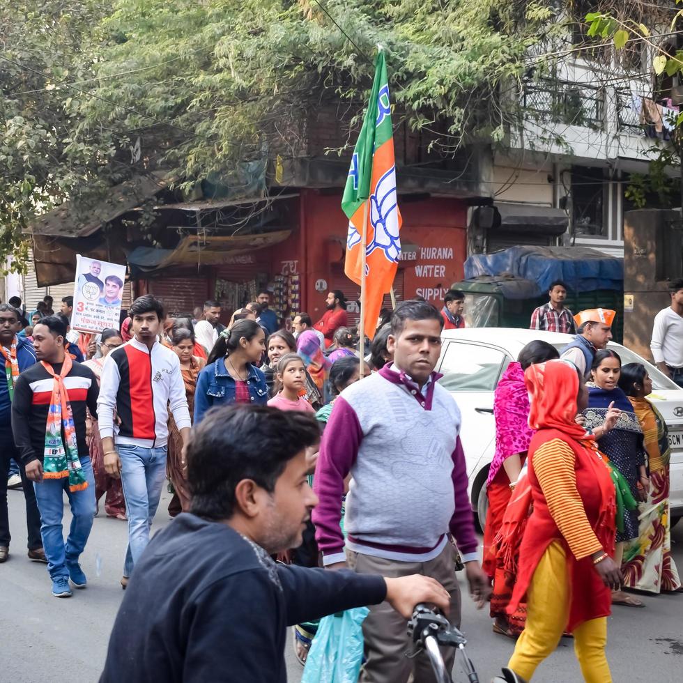 Delhi, India, March 02 2023 -Bharatiya Janata Party - BJP supporter during mega road show in support of BJP candidate Pankaj Luthara to file nomination papers ahead of MCD local body Elections 2022 photo