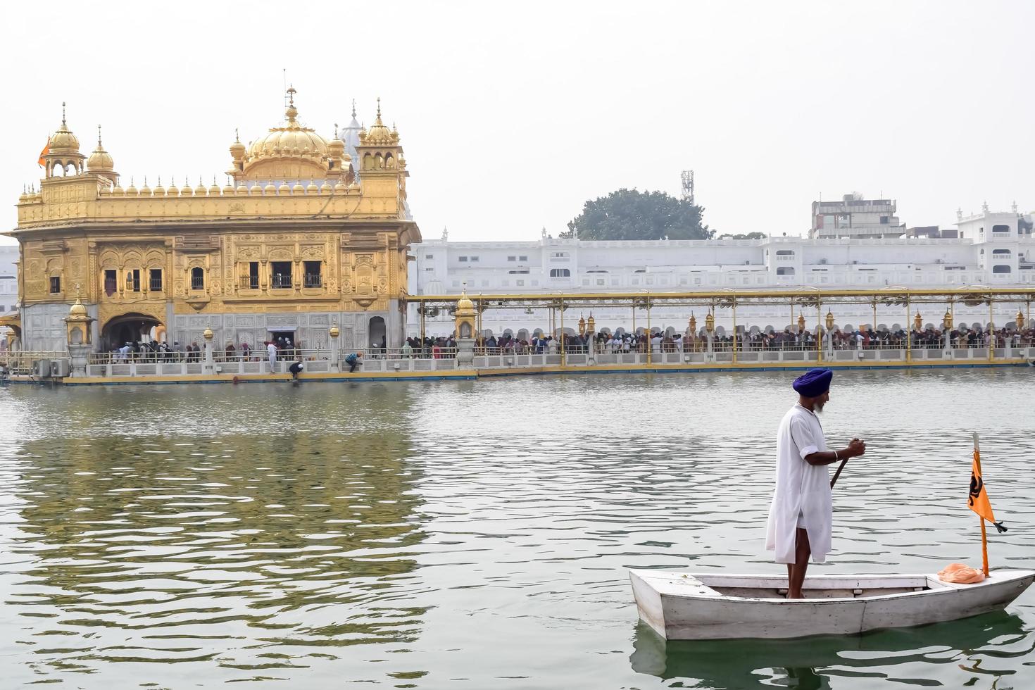 Amritsar, India - February 26 2023  - Unidentified devotees from various parts at Golden Temple - Harmandir Sahib in Amritsar, Punjab, India, Famous indian sikh landmark, Golden Temple photo