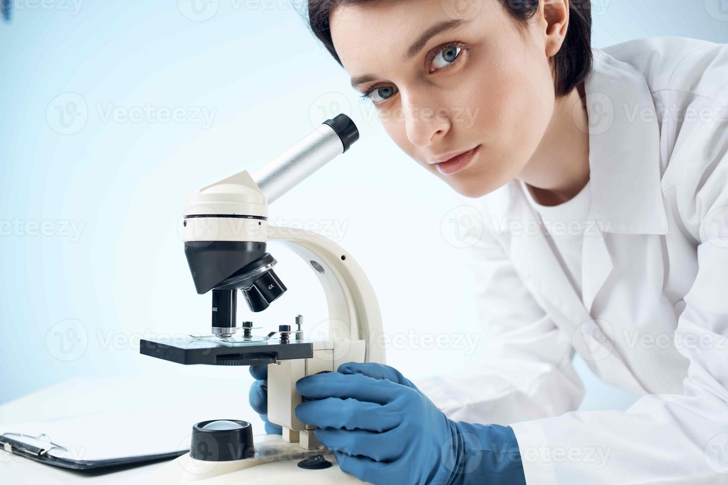 female laboratory assistant looking microscope diagnostics professional science photo