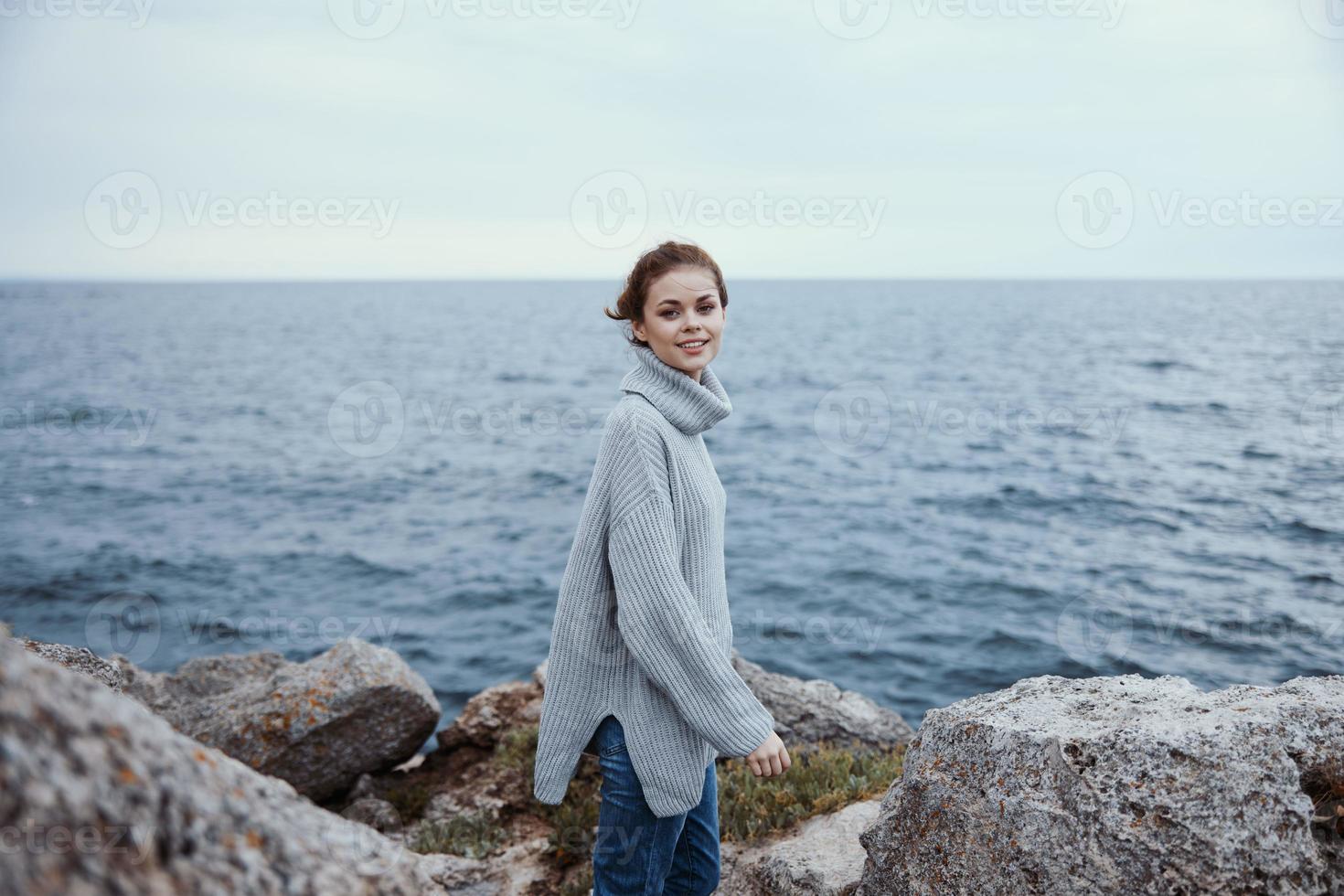 beautiful woman beach tourism cloudy weather stone coast unaltered photo