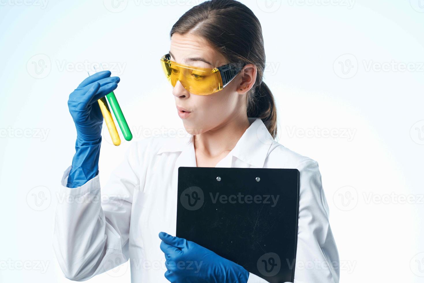 female laboratory assistant chemical solution analyzes biology professional photo